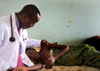 Dr-Henry-Ddungu-Treating-Cancer-Patient_Kampala-Uganda